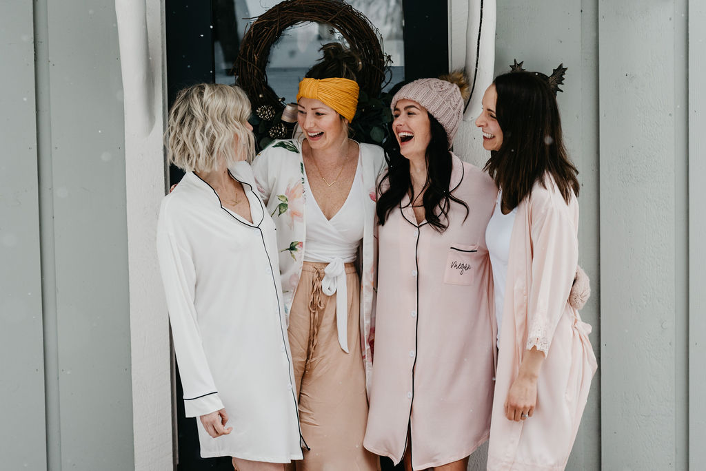 Bachelorettes outside their winter cottage celebrating in their cozy sleep shirt pajamas and robes.