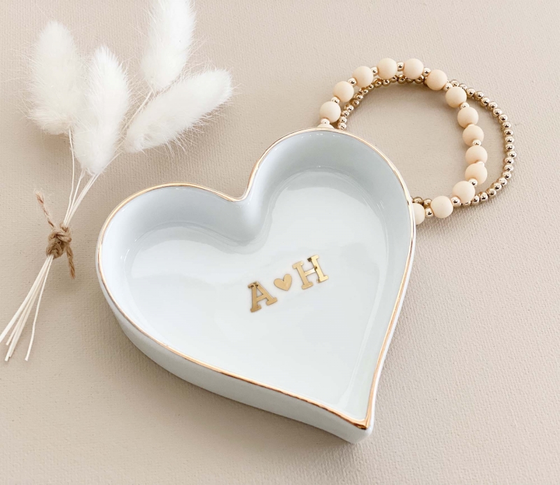 Discover our exquisite collection of gifts for the bride, including a monogrammed heart-shaped ring dish. This elegant and personalized dish is a perfect keepsake for the bride's precious rings, adding a touch of love and sophistication to her daily routine.