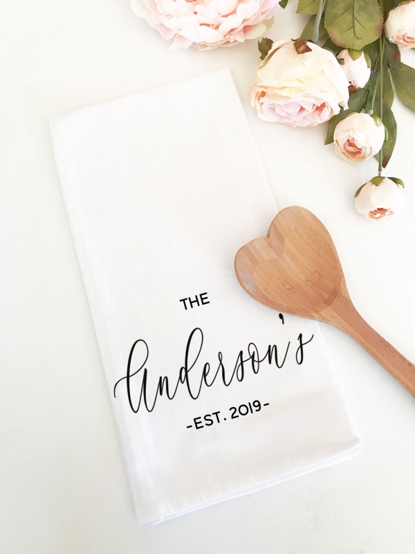 Elevate the bride's kitchen with our personalized kitchen towel, a wonderful addition to gifts for the bride. This stylish and practical towel showcases her joint last name and marriage year, adding a special touch to her forever home.