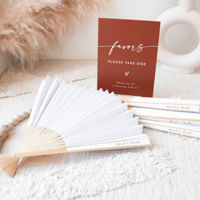  Capture hearts with these enchanting wedding favor paper fans, featuring a mesmerizing array of assorted colors adorned with custom black text. A perfect blend of style and utility, these delightful keepsakes bring a refreshing breeze of joy to your celebration.